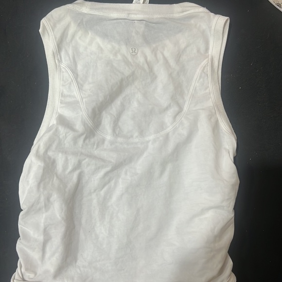 This is a white, size 4, Lululemon drawstring tank top! No stains! Smoke free 🏠 - Picture 3 of 4